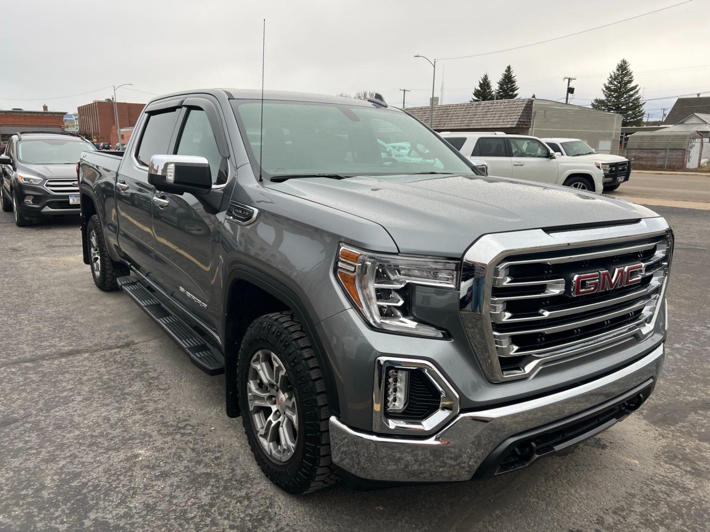 2021 Blue /Blue GMC Sierra 1500 SLT (3GTU9DED7MG) with an 5.3L V8 engine, automatic transmission, located at 116 5th Avenue South, Lewistown, MT, 59457, 47.063877, -109.427879 - Unleash the Power of the Roads with Our Pre-Owned 2021 GMC Sierra 1500 Crew Cab 4WD! Experience the thrill of the open road in this stunning GMC Sierra 1500, a beast on wheels that's ready to conquer any terrain! Don't miss your chance to own this powerful machine - now available in our pre-owned - Photo#0